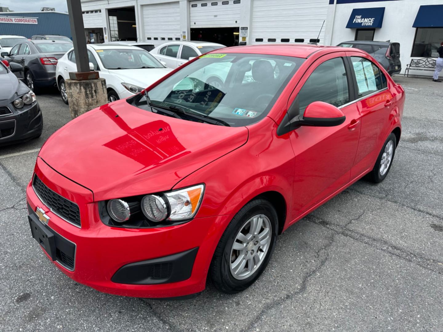 2015 RED Chevrolet Sonic LT Auto Sedan (1G1JC5SH6F4) with an 1.8L L4 DOHC 24V engine, 6-Speed Automatic transmission, located at 1254 Manheim Pike, Lancaster, PA, 17601, (717) 393-9133, 40.062870, -76.323273 - Photo#0